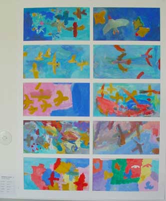 Children have painted birds flying in the sky with gouache.